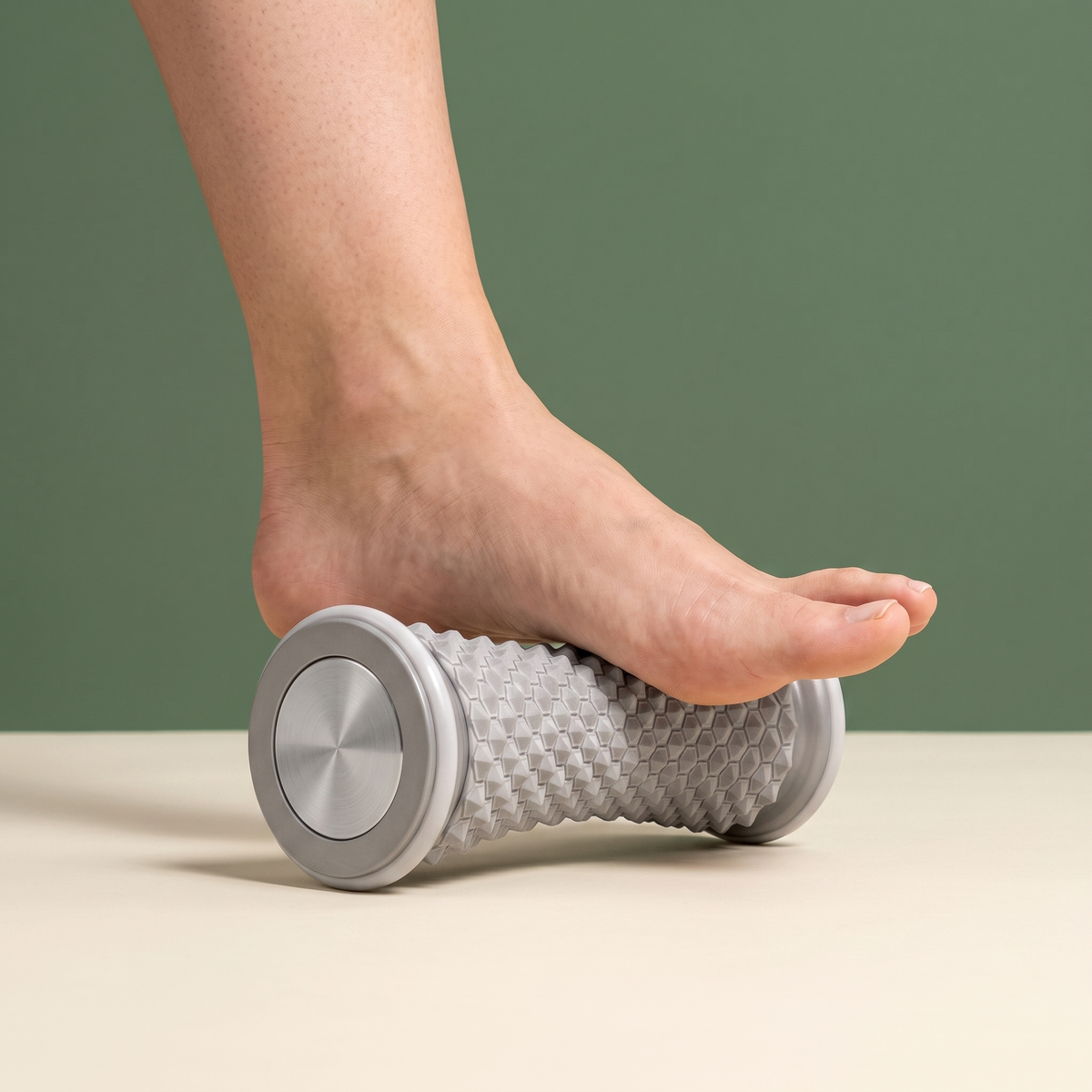 Bare foot rolling the arch on the Solacea foot massage roller