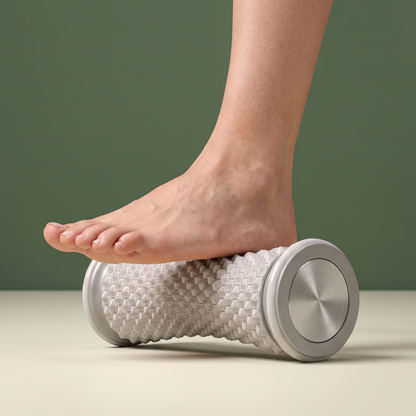 Bare foot with the heel on the Solacea foot massage roller